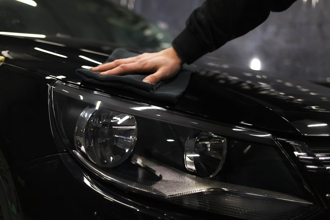 Person Wiping Car Exterior